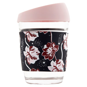 Glass travel mug with a floral printed silicone case